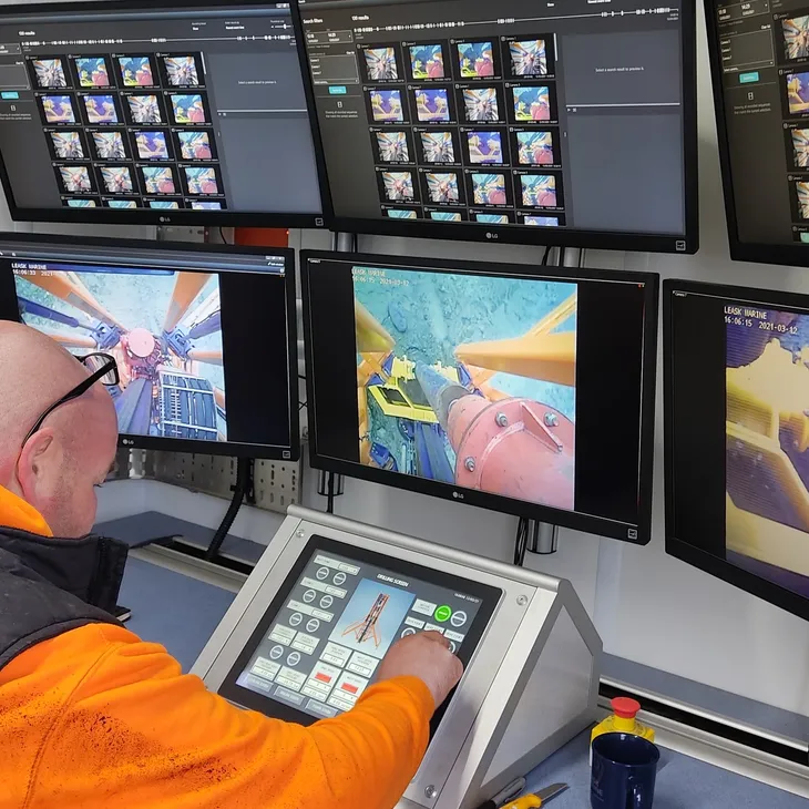 Operator monitoring subsea camera feeds at the Raptor drilling control console