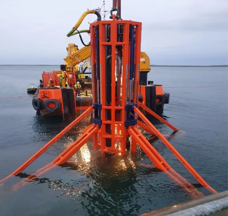 Raptor Submersible Drilling Rig being deployed at sea alongside a support vessel